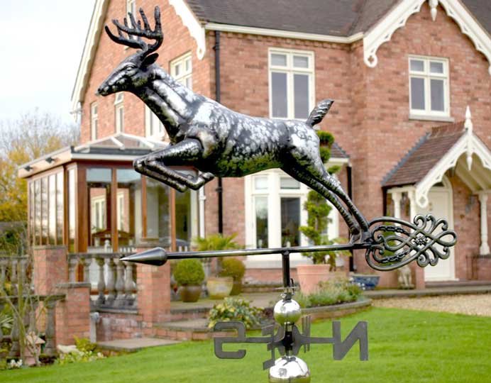 photo of weathervane infront of a house